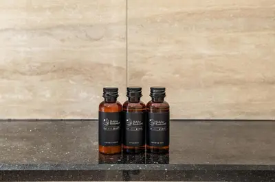 two bottles of whiskey sitting on a counter at BLVD - Stylish Missoni Stay - Canal View in Dubai