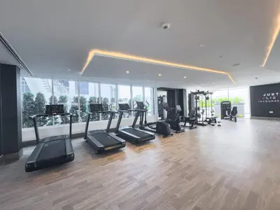 a gym with treadmills and exercise equipment in a building at StayShort - Al Barsha Apartment Sleeps 2 with Private Balcony in Dubai
