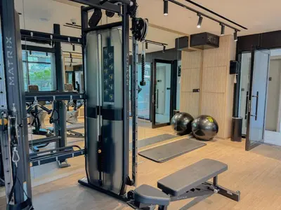 a gym with a bunch of equipment in it at Binghatti Crest in Dubai