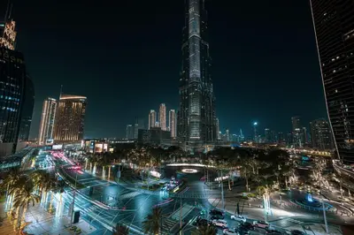 a city skyline at night with a lot of traffic at Luxury Burj Vista Suites by Mystique - Breathtaking Burj Khalifa Views in Dubai
