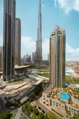a view of a city with tall buildings at Act 1 Act 2 Towers, Luxury 4BR, Full Burj Khalifa View Balcony, Pool, Gym in Dubai