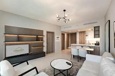 a living room with a couch and a fireplace at Exciting 1BR apartment Liv Marina in JBR in Dubai