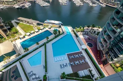 an overhead view of a building with a swimming pool at Exciting 1BR apartment Liv Marina in JBR in Dubai
