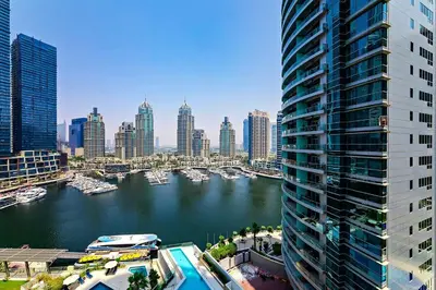 a view of a city with boats in the water at Exciting 1BR apartment Liv Marina in JBR in Dubai