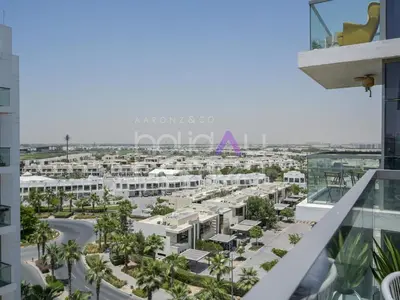 an aerial view of the city from the balcony of a building at Modern 2BR Gem Full Golf Views & Pool in Dubai