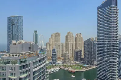 a view of a large city with tall buildings at Spacious 1BR in Great Location, Manchester Tower, Dubai Marina in Dubai