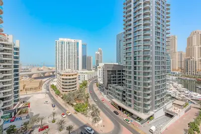 an aerial view of a city with tall buildings at Spacious 1BR in Great Location, Manchester Tower, Dubai Marina in Dubai