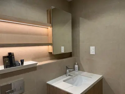 a bathroom with a sink and a mirror at 1 Bedroom Apartment in Liva by the S Holiday Homes in Dubai
