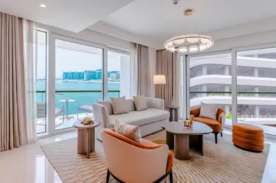 a living room with a couch and chairs at Sea Breeze apartment in Grand Bleu - private Beach in Dubai