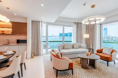 a living room with a couch and a table at Sea Breeze apartment in Grand Bleu - private Beach in Dubai
