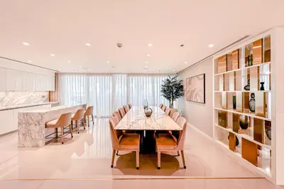 a dining room with a table and chairs at Sea Breeze apartment in Grand Bleu - private Beach in Dubai
