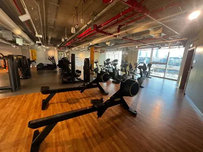 a gym with treadmills and exercise equipment in a room at 2min Walk to Dubai Mall - 2BR - Infinity Pool & Gym - Burj Khalifa in Dubai