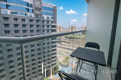 a balcony with a view of a large building at LUX The Seven Res Palm Studio in Dubai