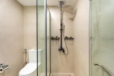 a bathroom with a glass shower with a toilet at GuestReady - Luxury 2BD w/ balcony | Business Bay in Dubai