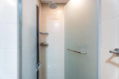 a shower with a glass door in a bathroom at GuestReady - Luxury 2BD w/ balcony | Business Bay in Dubai