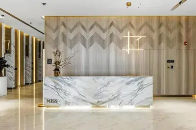 a lobby with a large marble table in a building at BLVD - Missoni Canal View - Walk to Dubai Mall in Dubai