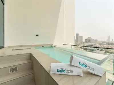 a swimming pool in the middle of a building at Upscale 2Bedroom with Private Balcony Pool in JVC in Dubai