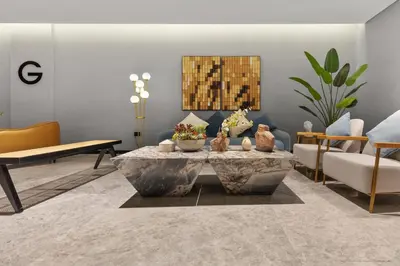 a living room with a couch and a coffee table at Waves - Stylish Studio Near Downtown Dubai in Dubai