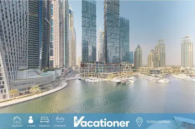 a view of a city with boats in the water at Iris Blue - Colourful One Bedroom in The Marina in Dubai