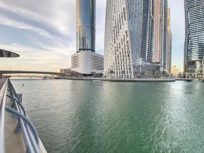 a view of a river in a city with tall buildings at Iris Blue - Colourful One Bedroom in The Marina in Dubai