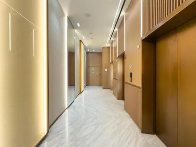 a corridor of a hotel with wooden walls and a long hallway at GuestReady - Top-Floor Tranquillity in JVC in Dubai