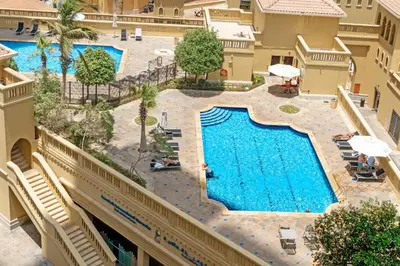 an overhead view of a swimming pool in a hotel at Rimal 3, JBR - Studio Apartment - Allsopp & Allsopp in Dubai