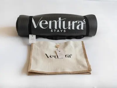 a bottle of vermilion sits on top of a bag at Dubai Hills 2BR Full Park View and Designer Style in Dubai