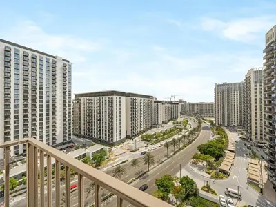 a view of a city with tall buildings at Modern 1BR with Cinema, Pool and Gym Dubai Hills in Dubai