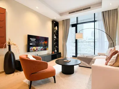 a living room with a couch and a table at Luxe 1BR in RP Heights Downtown - 50mt to Dubai Mall, walk to Burj Khalifa and Fountain in Dubai