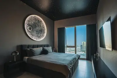 a bedroom with a bed and a large window at Bitcoin Moonrise 2BR - Grande Burj Views in Dubai