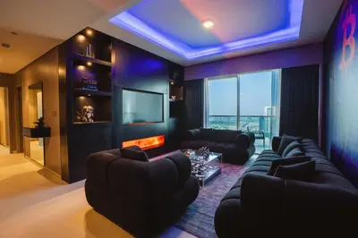 a living room with a couch and a fire place at Bitcoin Moonrise 2BR - Grande Burj Views in Dubai