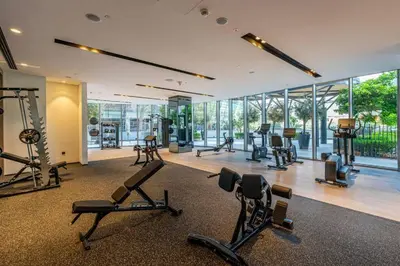 a gym with many exercise equipment in a room at Bitcoin Moonrise 2BR - Grande Burj Views in Dubai