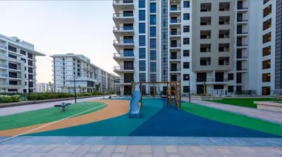a playground in the middle of a city with tall buildings at Silk Valley - Modern 2BR Near Park & Attractions in Dubai