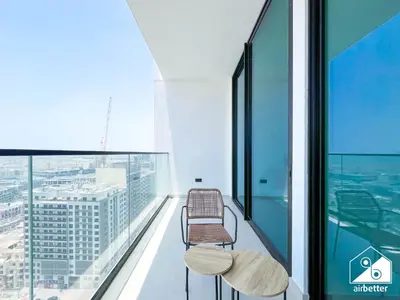 a balcony with two benches on top of a building at Stylish 1BR Retreat in Binghatti Amber l Balcony in Dubai
