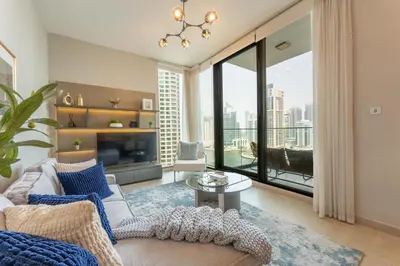 a living room with a couch and a table at Unique & Stunning Marina Views LIV Residence 2BR in Dubai