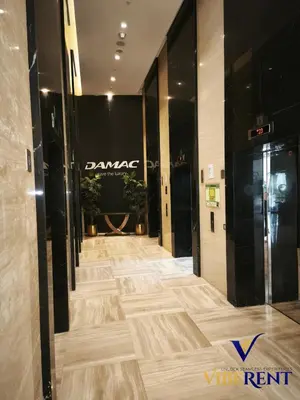 a view of a hallway in a building with wood floors at Damac 1BHK, Terrance Pool, 20 Min to Downtown in Dubai