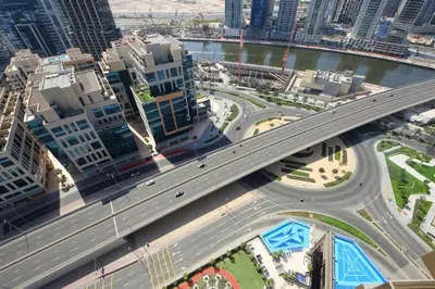 an overhead view of a highway in a city with buildings at Dubai Downtown Canal View Studio 2306 in Dubai