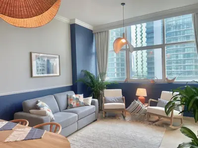 a living room with a couch and a chair at Sea Breeze Luxury 2BR, Dubai Marina, Big Terrace, Near Beach, Pool access, by Stay Vista! for up to 6 Guests in Dubai
