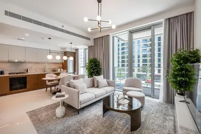 a living room with a couch and a table at Beach Isle 1 Emaar Beachfront - Mint Stay in Dubai