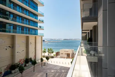 a view of the ocean from the balcony of a building at Beach Isle 1 Emaar Beachfront - Mint Stay in Dubai