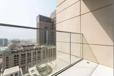 a view from the balcony of a building at Luxury 2BR with Canal & Pool View Nr Downtown in Dubai