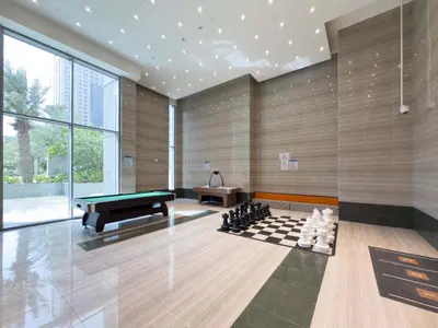 a room with a pool table and a chessboard at Luxury 2BR with Canal & Pool View Nr Downtown in Dubai