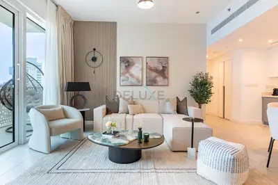 a living room with a couch and a table at Steps from Marina Beach, AquaFun & The Walk, Mins to Bluewaters Island and Ain Dubai - La Vie, Jumeirah Beach Residence by Deluxe Holiday Homes in Dubai