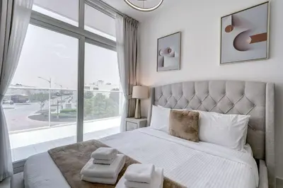 a bedroom with a large bed with a large window at PVH - Chic 3BR Villa with Backyard - Albizia in Dubai