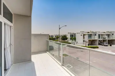 an apartment balcony with a view of a parking lot at PVH - Chic 3BR Villa with Backyard - Albizia in Dubai