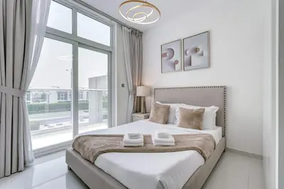 a white bedroom with a large bed and a window at PVH - Chic 3BR Villa with Backyard - Albizia in Dubai
