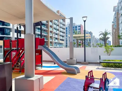a playground with a slide in a building at Amazing Studio in Meydan l Pool , Gym & Balcony in Dubai