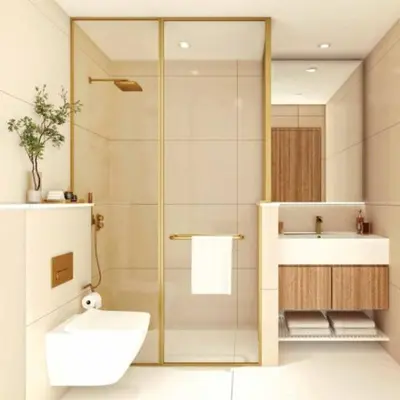 a bathroom with a shower and a toilet and a sink at Stylish 1-Bedroom Apartment in Dubai