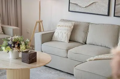 a living room with a couch and a coffee table at Mahogany 17 - 2BR 10PAX - On the Boulevard Sea View in Dubai