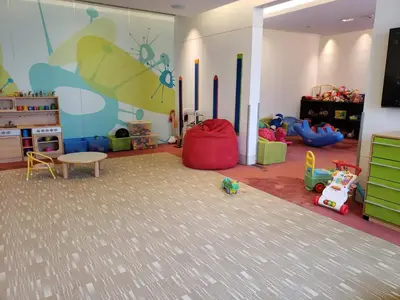 a room with a room with toys in it at Deluxe 1 BR At Address Apartments Marina Mall by Primevanguard in Dubai